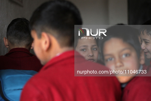 A school boy is pictured on the first day of school in Srinagar, Kashmir, on March 4, 2024. Schools across Kashmir are reopening after a thr...