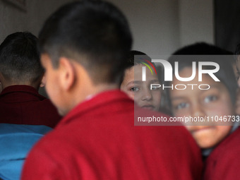 A school boy is pictured on the first day of school in Srinagar, Kashmir, on March 4, 2024. Schools across Kashmir are reopening after a thr...