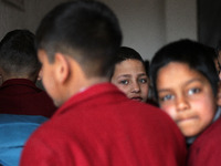 A school boy is pictured on the first day of school in Srinagar, Kashmir, on March 4, 2024. Schools across Kashmir are reopening after a thr...