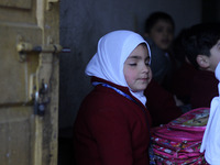 A schoolboy is sitting in the classroom on the first day of school in Srinagar, Kashmir, on March 4, 2024. Schools across Kashmir are reopen...