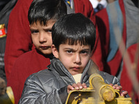 A school boy is pictured on the first day of school in Srinagar, Kashmir, on March 4, 2024. Schools across Kashmir are reopening after a thr...