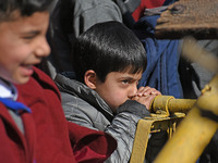 A school boy is pictured on the first day of school in Srinagar, Kashmir, on March 4, 2024. Schools across Kashmir are reopening after a thr...