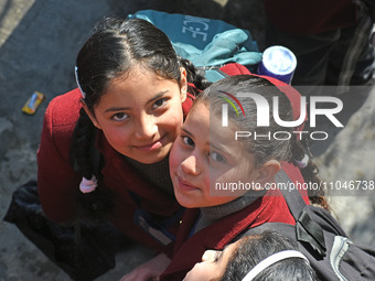 School children are arriving on the first day in Srinagar, Kashmir, on March 4, 2024. Schools across Kashmir are reopening after a three-mon...