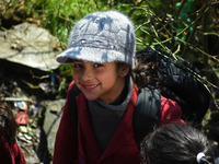 A school girl is pictured on the first day of school in Srinagar, India, on March 4, 2024. Schools across Kashmir are reopening after a thre...