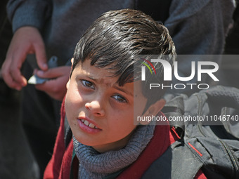 A school boy is pictured on the first day of school in Srinagar, Kashmir, on March 4, 2024. Schools across Kashmir are reopening after a thr...