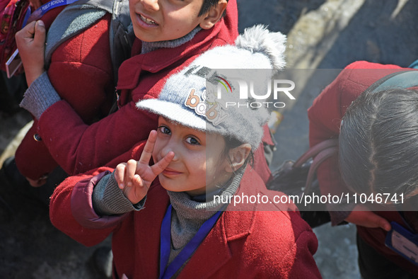 A school girl is pictured on the first day of school in Srinagar, India, on March 4, 2024. Schools across Kashmir are reopening after a thre...