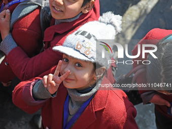 A school girl is pictured on the first day of school in Srinagar, India, on March 4, 2024. Schools across Kashmir are reopening after a thre...