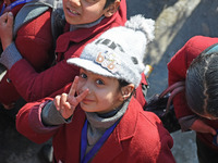 A school girl is pictured on the first day of school in Srinagar, India, on March 4, 2024. Schools across Kashmir are reopening after a thre...