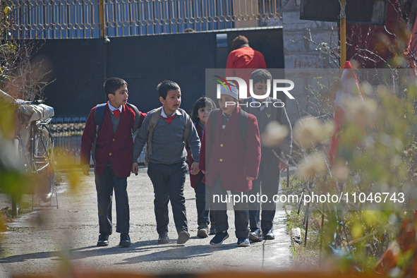 School children are arriving on the first day in Srinagar, Kashmir, on March 4, 2024. Schools across Kashmir are reopening after a three-mon...