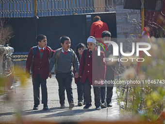 School children are arriving on the first day in Srinagar, Kashmir, on March 4, 2024. Schools across Kashmir are reopening after a three-mon...