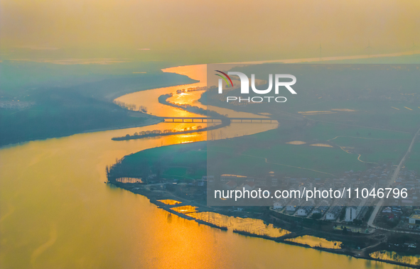 The Huaihongxin River is winding through Shuanggou town in Suqian, China, at sunset on March 3, 2024. 