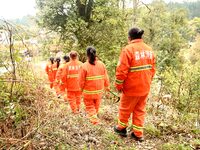 Female volunteer members are patrolling the forest in the mountains in Jinpin County, Guizhou, China, on March 5, 2024. (