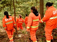 Female volunteer members are patrolling the forest in the mountains in Jinpin County, Guizhou, China, on March 5, 2024. (