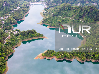 An aerial photo is showing the water diversion project of Chebahe Reservoir in Enshi, Hubei Province, Central China, on May 11, 2023. In 202...