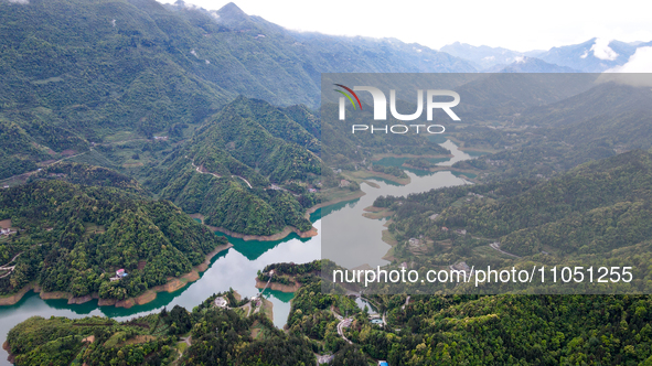 An aerial photo is showing the water diversion project of Chebahe Reservoir in Enshi, Hubei Province, Central China, on May 11, 2023. In 202...