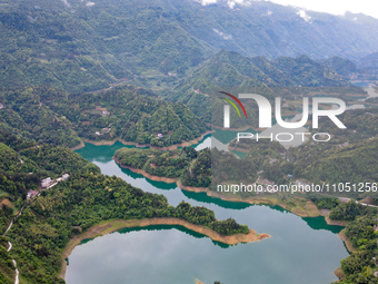 An aerial photo is showing the water diversion project of Chebahe Reservoir in Enshi, Hubei Province, Central China, on May 11, 2023. In 202...