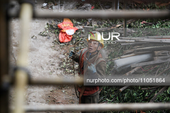 Construction workers are working at the renovation site of an old residential area in Wenhua Yi Village, Jiulongpo district, in Chongqing, C...