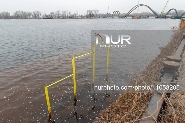 A horizontal bar is submerged in the area of Natalka Park in Kyiv, Ukraine, on March 6, 2024, due to increased water discharges from the Kyi...