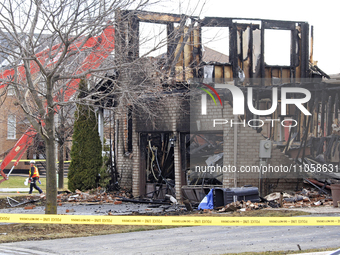 Demolition crews are walking in front of a home that is being torn down after it was destroyed by a reported explosion and fire in Brampton,...