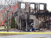 Demolition crews are walking in front of a home that is being torn down after it was destroyed by a reported explosion and fire in Brampton,...