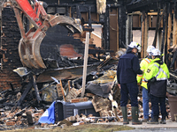 Demolition crews and fire officials are watching as a home is being torn down after it was destroyed by a reported explosion and fire in Bra...