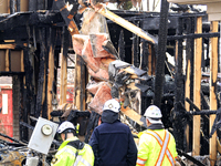 Demolition crews and fire officials are watching as a home is being torn down after it was destroyed by a reported explosion and fire in Bra...