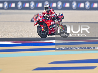 Italian MotoGP rider Enea Bastianini of the Ducati Lenovo Team is in action during the Free Practice 1 session of the Qatar Airways Motorcyc...