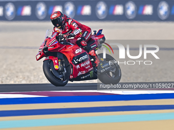 Italian MotoGP rider Francesco Bagnaia of the Ducati Lenovo Team is in action during the Free Practice 1 session of the Qatar Airways Motorc...