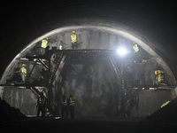 Workers are preparing for blasting at the exit of the Tiemengguan tunnel in Bazhou, Xinjiang province, China, on March 9, 2024. (