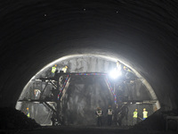 Workers are preparing for blasting at the exit of the Tiemengguan tunnel in Bazhou, Xinjiang province, China, on March 9, 2024. (