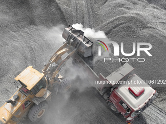 Workers are preparing materials for tunnel reinforcement at the exit of the Tiemengguan tunnel in Bazhou, Xinjiang province, China, on March...