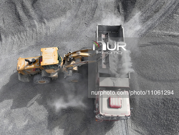 Workers are preparing materials for tunnel reinforcement at the exit of the Tiemengguan tunnel in Bazhou, Xinjiang province, China, on March...