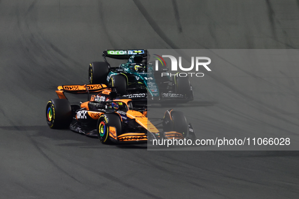 Oscar Piastri of McLaren and Fernando Alonso of Aston Martin Aramco during the Formula 1 Saudi Arabian Grand Prix at Jeddah Corniche Circuit...