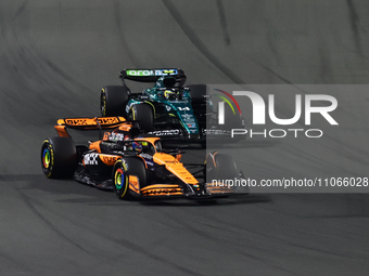 Oscar Piastri of McLaren and Fernando Alonso of Aston Martin Aramco during the Formula 1 Saudi Arabian Grand Prix at Jeddah Corniche Circuit...