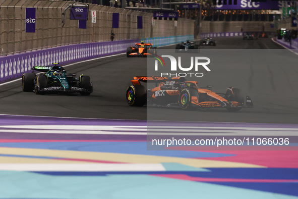 Oscar Piastri of McLaren and Fernando Alonso of Aston Martin Aramco during the Formula 1 Saudi Arabian Grand Prix at Jeddah Corniche Circuit...