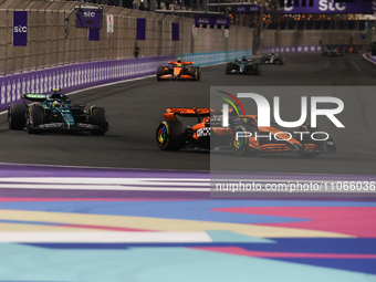 Oscar Piastri of McLaren and Fernando Alonso of Aston Martin Aramco during the Formula 1 Saudi Arabian Grand Prix at Jeddah Corniche Circuit...