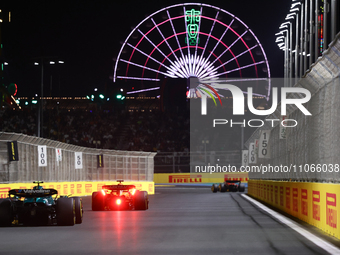 Oscar Piastri of McLaren and Lance Stroll of Aston Martin Aramco during the Formula 1 Saudi Arabian Grand Prix at Jeddah Corniche Circuit in...