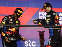 Sergio Perez and Max Verstappen of Red Bull Racing at the podium after the Formula 1 Saudi Arabian Grand Prix at Jeddah Corniche Circuit in...