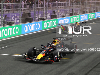 Max Verstappen and Sergio Perez of Red Bull Racing after the Formula 1 Saudi Arabian Grand Prix at Jeddah Corniche Circuit in Jeddah, Saudi...