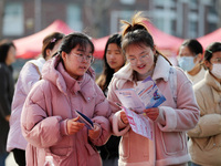 Female college students are looking for jobs at the 2024 Women's Campus job fair in Huaibei, Anhui province, China, on March 12, 2024. (