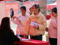 Female college students are looking for jobs at the 2024 Women's Campus job fair in Huaibei, Anhui province, China, on March 12, 2024. (