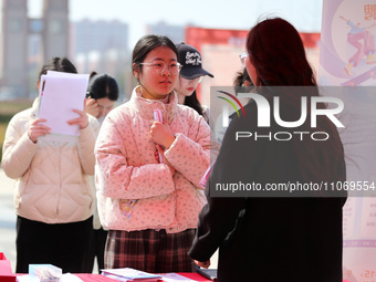 Female college students are looking for jobs at the 2024 Women's Campus job fair in Huaibei, Anhui province, China, on March 12, 2024. (