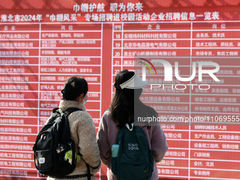 Female college students are looking for jobs at the 2024 Women's Campus job fair in Huaibei, Anhui province, China, on March 12, 2024. (