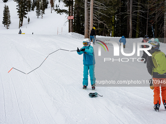 Andy Anderson, an Avalanche Forecaster with the Sierra Avalanche Center, is leading an avalanche transceiver workshop at Sugar Bowl Resort i...