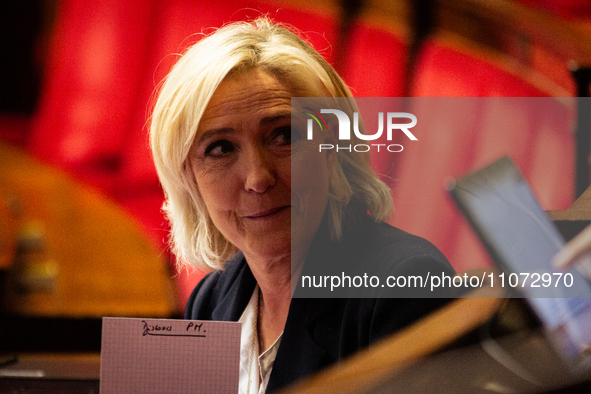 In Paris, France, on March 12, 2024, Marine Le Pen, president of the Rassemblement National group, is showing a paper that says ''Prime-Mini...