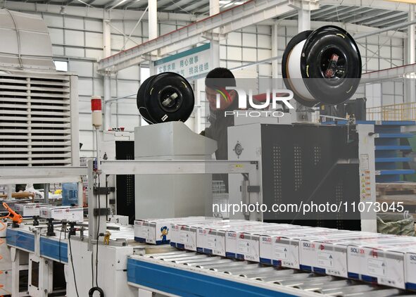 A worker is operating equipment in a digital intelligent production workshop at a hardware manufacturing company in Handan, North China's He...