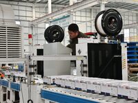 A worker is operating equipment in a digital intelligent production workshop at a hardware manufacturing company in Handan, North China's He...