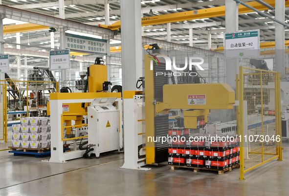 Workers are operating equipment in a digital intelligent workshop at a hardware manufacturing company in Handan, China, on March 12, 2024. 