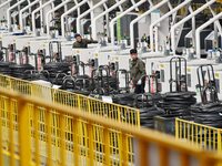 A worker is operating equipment in a digital intelligent production workshop at a hardware manufacturing company in Handan, North China's He...