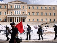 Police is standing in front of the parliament building while demonstrators attend a protest held by 
student associations and educational u...